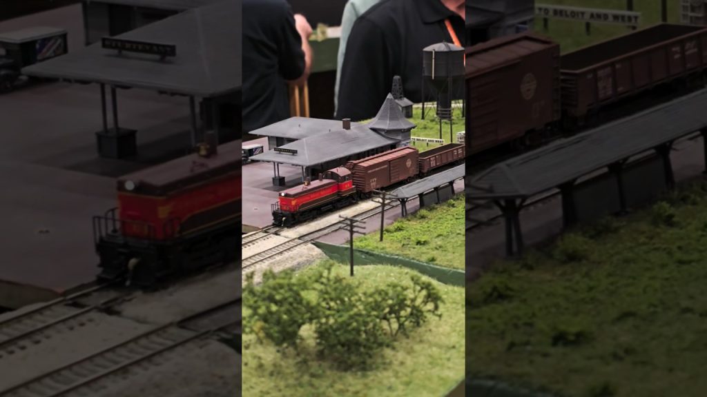 N Scale Chicago Great Western NW2 freight train passes rural station! #modeltrains #modelrailroad